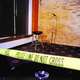 Police tape stretches across the stage where Tony Campanelli slayed 180 comedy-club patrons.
